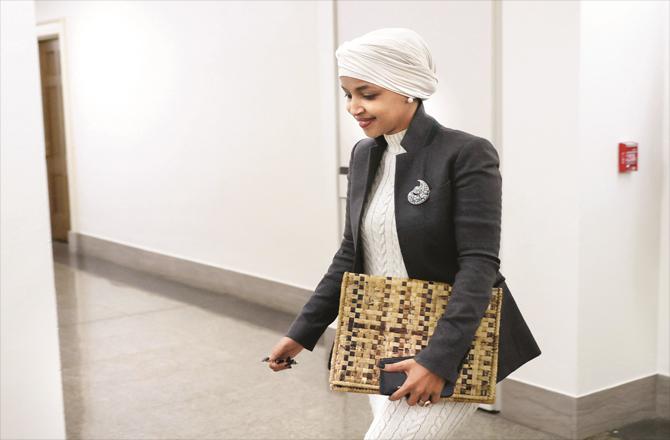 Ilhan Omar leaving his office after the bill was passed.
